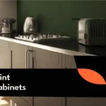 Homeowner painting kitchen cabinets with a roller for a smooth finish.
